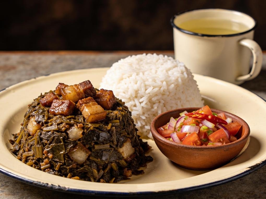 Ravitoto, pounded cassava leaves stewed with fatty pork, served over rice, Madagascar main